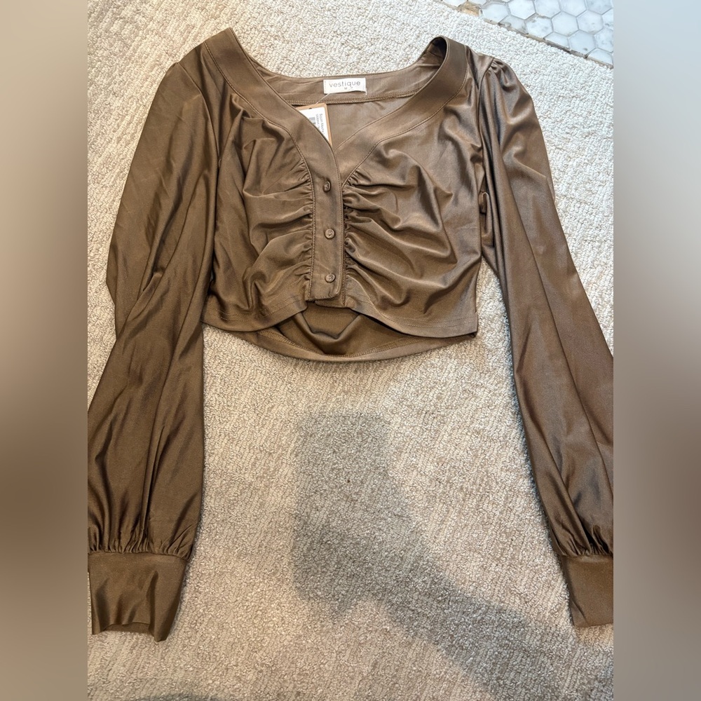 Vestique top
Size Medium